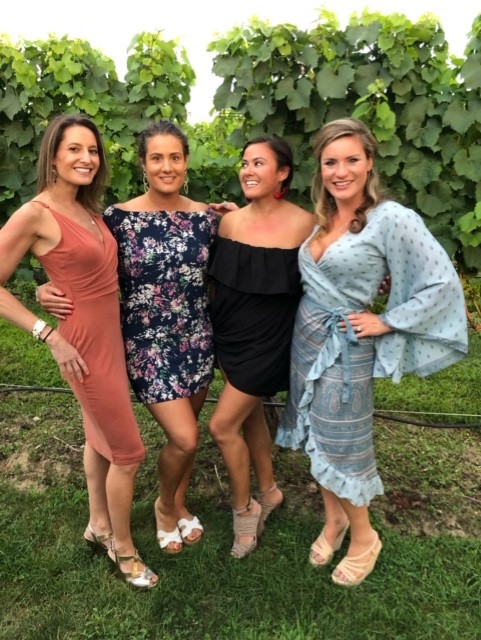 SVP Melanie Klausner (far left) explored the vineyards of Long Island with friends